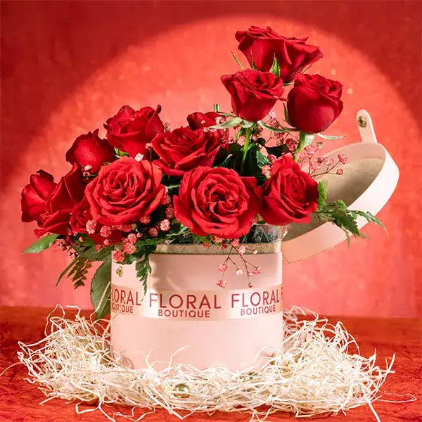 20 red roses and gypsophila in a pink box front view
