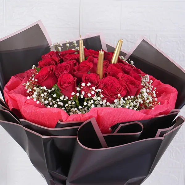 20 red roses bouquet warped in red and black paper close up view