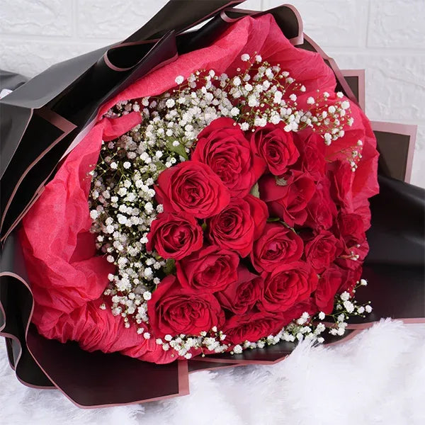 20 red roses bouquet warped in red and black paper top view