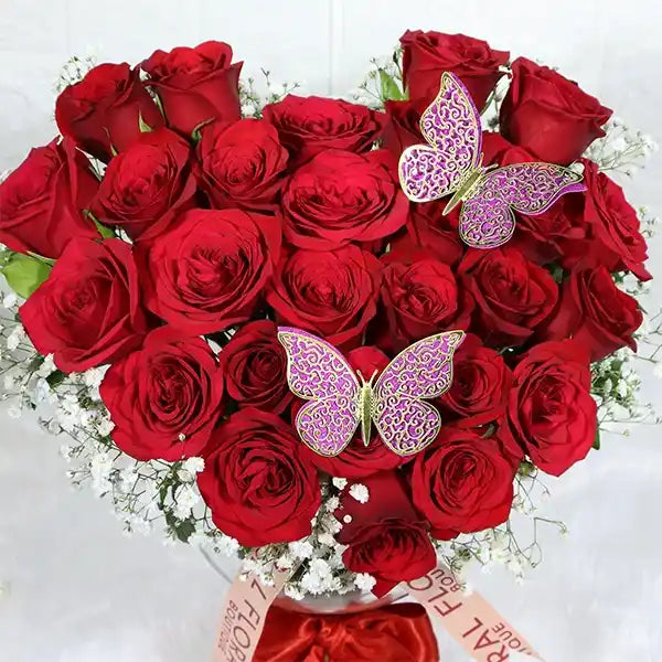 25 red roses in glass vase close up view