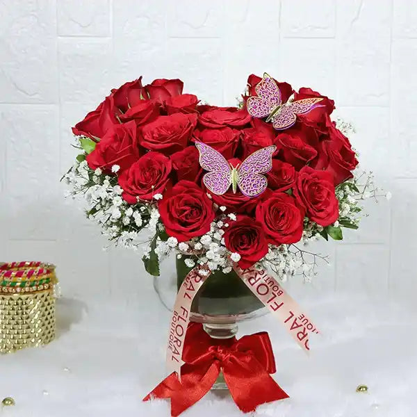 25 red roses in glass vasefront view