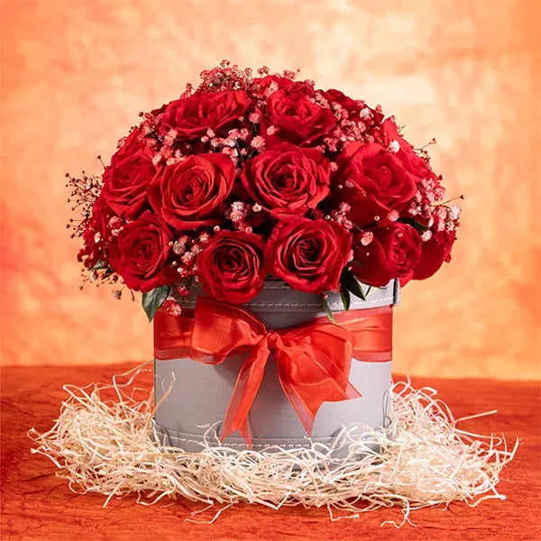 30 red roses and gypsophila in a gray leather box front view