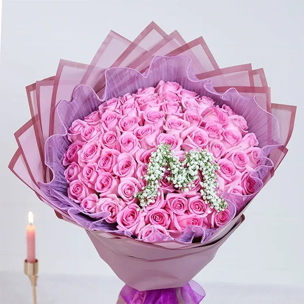 60 pink rose bouquet with purple mesh close up view