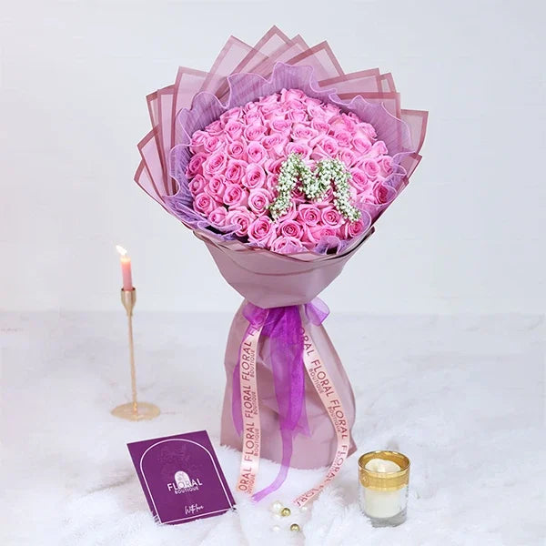 60 pink rose bouquet with purple mesh front view
