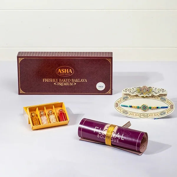 aqua jewel rakhi with asha baklava roli chawal front view