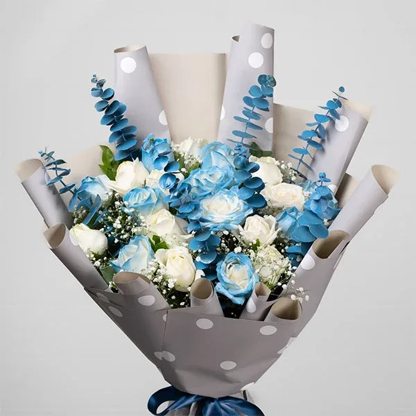 blue and white rose bouquet with elegant wrapping closeup view