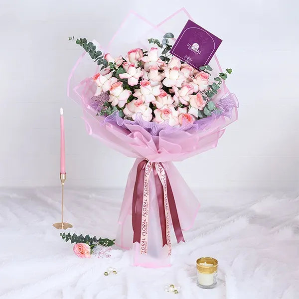 jumilia pink rose bouquet in pink wrapping paper front view 3