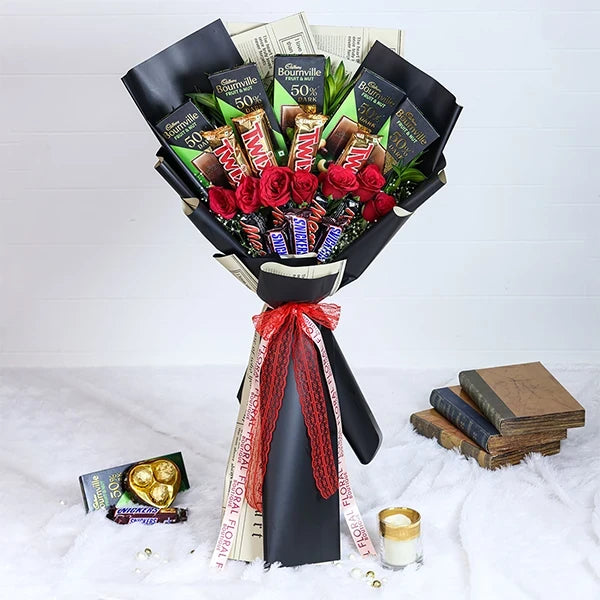 chocolate bouquet with red roses wrapped in black paper front view