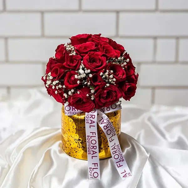 30 red roses and gypsophila in a glass vase front view