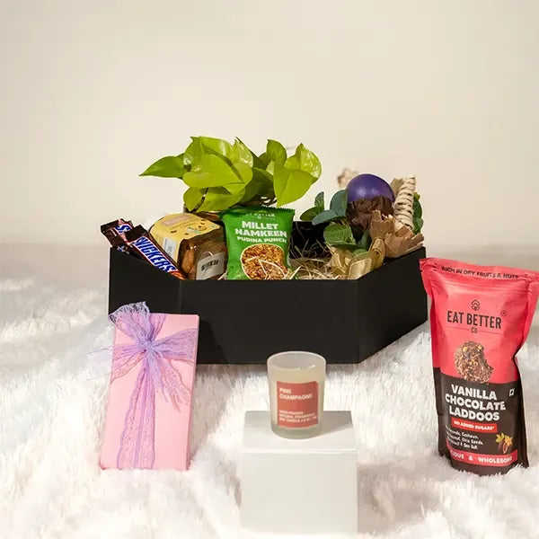 elegant hamper featuring gourmet snacks rich chocolates and a stylish pot front view 2