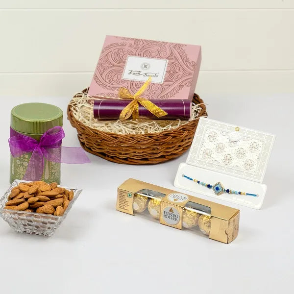 distinctive azure rakhi with almonds and ferrero rocher hamper front view