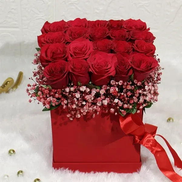 elegant box of 20 red roses with gypsophila close up view