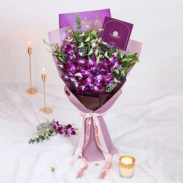 orchid bouquet with purple wrap front view
