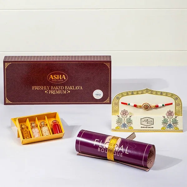 ethnic charm rakhi with asha baklava roli chawal front view
