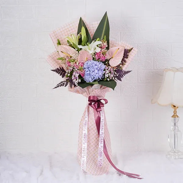 white oriental lily stems hydrangea anthurium bouquet front view
