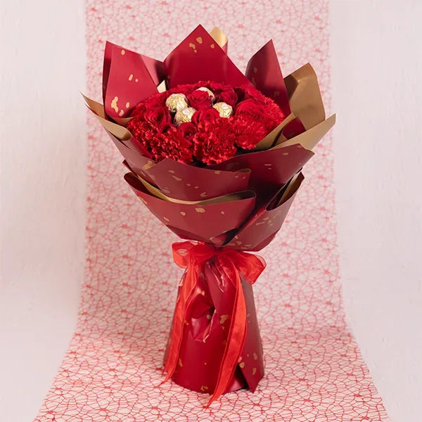 chocolate bouquet of red roses and red carnations with ferrero rocher front view