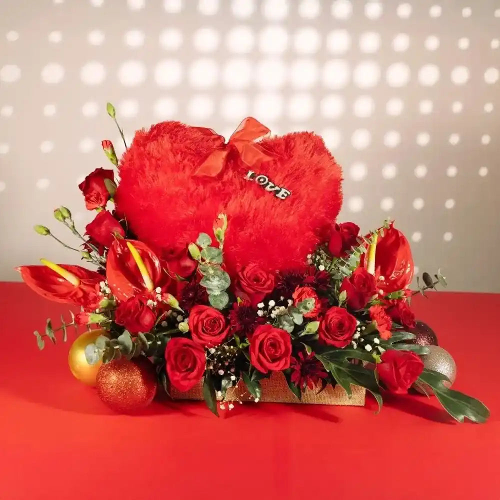 red flowers heart cushion in jute front view 2