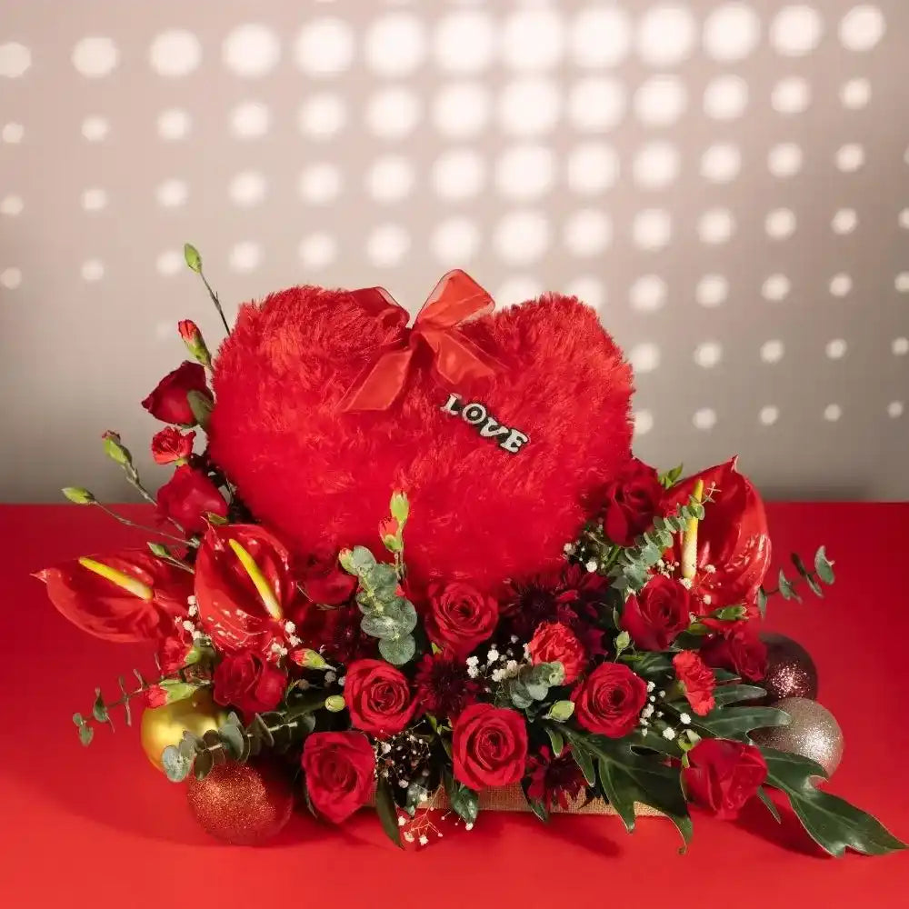 red flowers heart cushion in jute front view 3