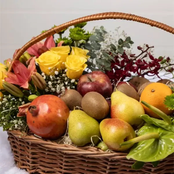 flower and mix fruits basket closeup view