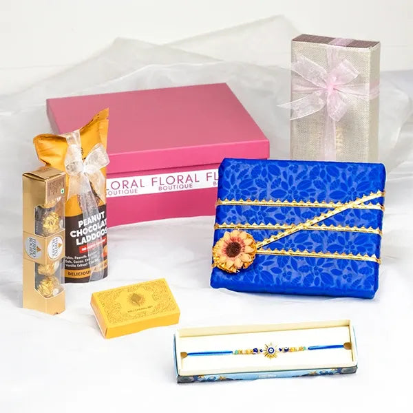 golden evil eye sun rakhi grand hamper front view