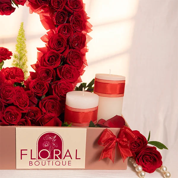 heart shaped arrangement with 60 red roses close up view 2