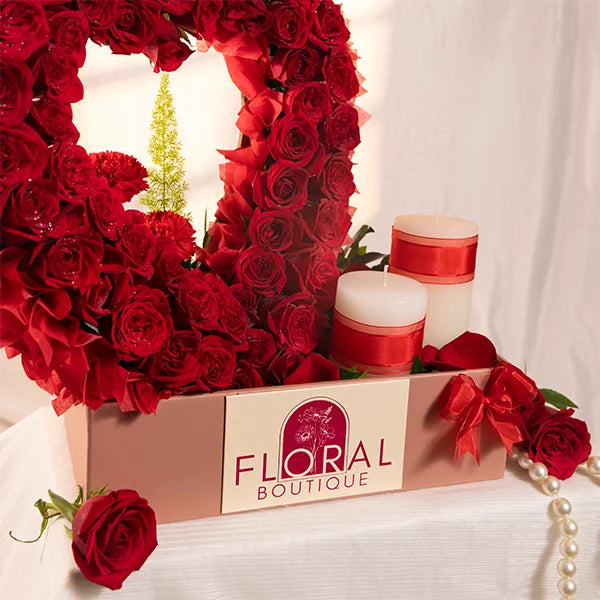 heart shaped arrangement with 60 red roses close up view