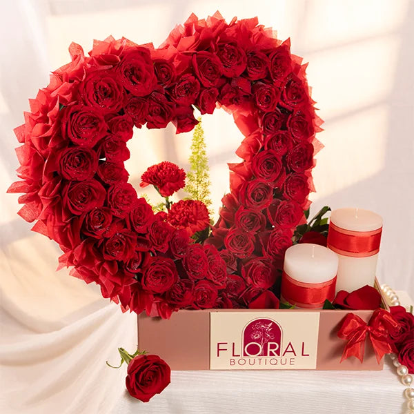 heart shaped arrangement with 60 red roses front view 2