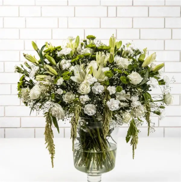 white rose asiatic lily white green button chrysanthemum in a glass vase front view 2