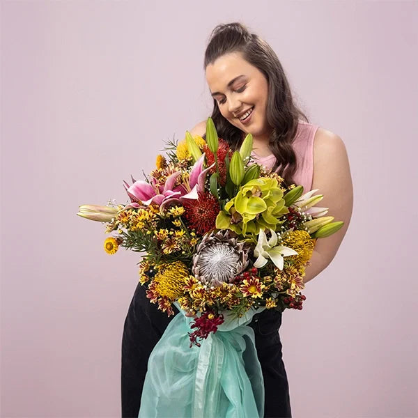 luxurious oriental lily and king protea flower arrangement front view