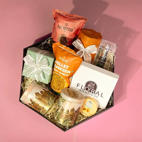 luxury perfume hamper for him with chocolates and snacks top view