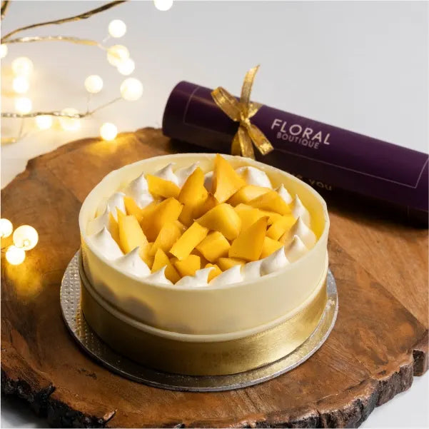 mango cream cheese one kg cake with white chocolate top view