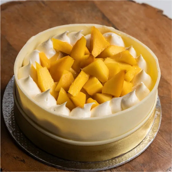 mango cream cheese one kg cake with white chocolate front view