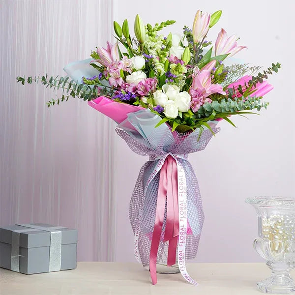 mix flower bouquet of pink oriental lilies with white flowers front view 2