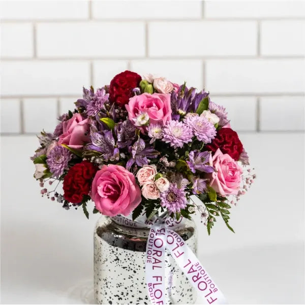 mix pink flowers in silver vase front view 2