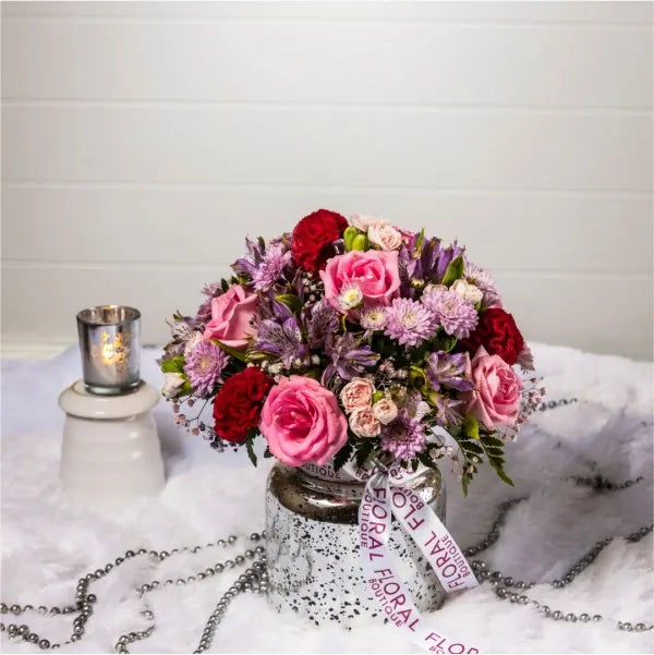 mix pink flowers in silver vase front view