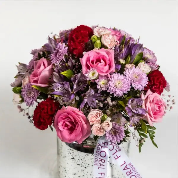 mix pink flowers in silver vase top view