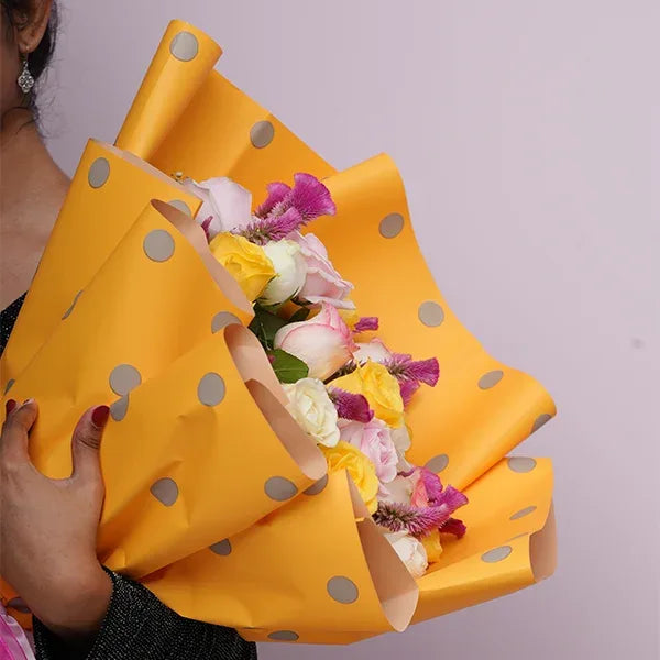 mix roses bouquet of yellow jumilia sweet pink white rose close up view