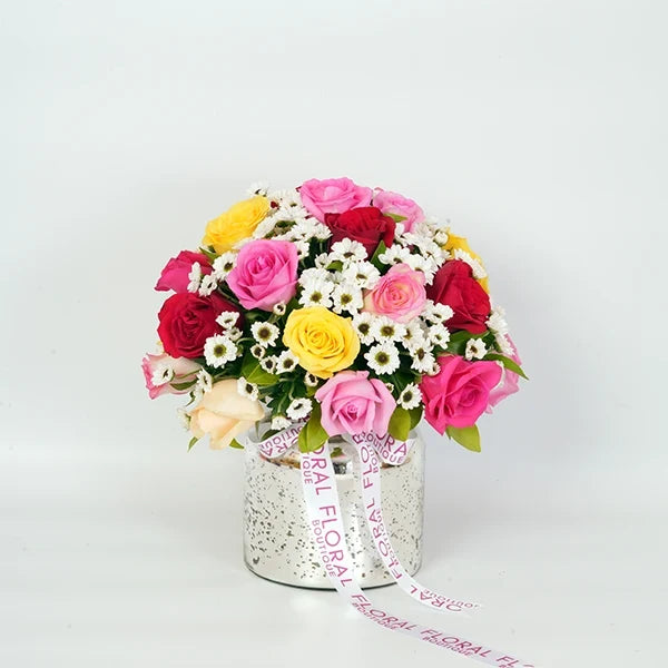 mix roses with white santoni in a sliver glass vase front view 2