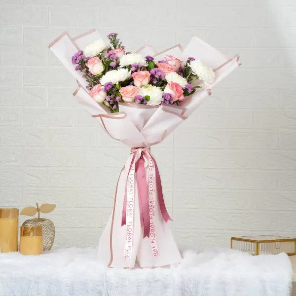 mixed flower bouquet of pink roses white disbuds front view