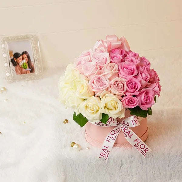 mixed roses in pink box front view 2