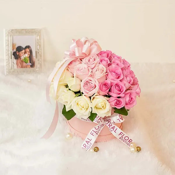 mixed roses in pink box top view