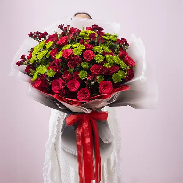 mix flower bouquet of red rose with red carnation front view 2