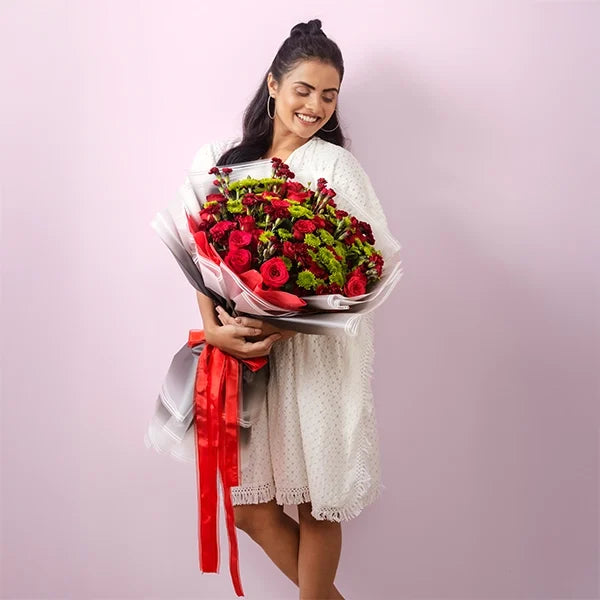 mix flower bouquet of red rose with red carnation front view