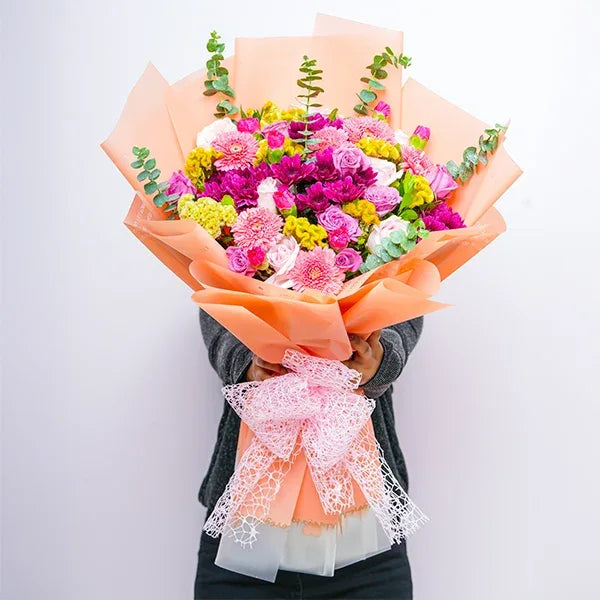 mix flower bouquet of purple chrysanthemum Purple and avalanche rose front view