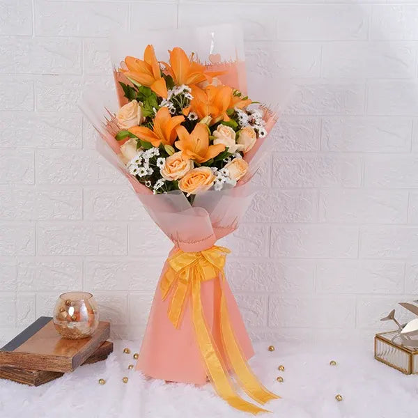 asiatic lily bouquet with peach roses santoni front view