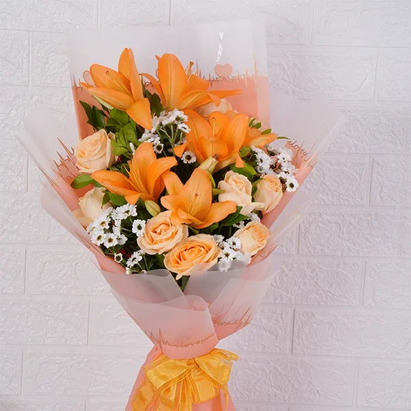 asiatic lily bouquet with peach roses santoni close up view
