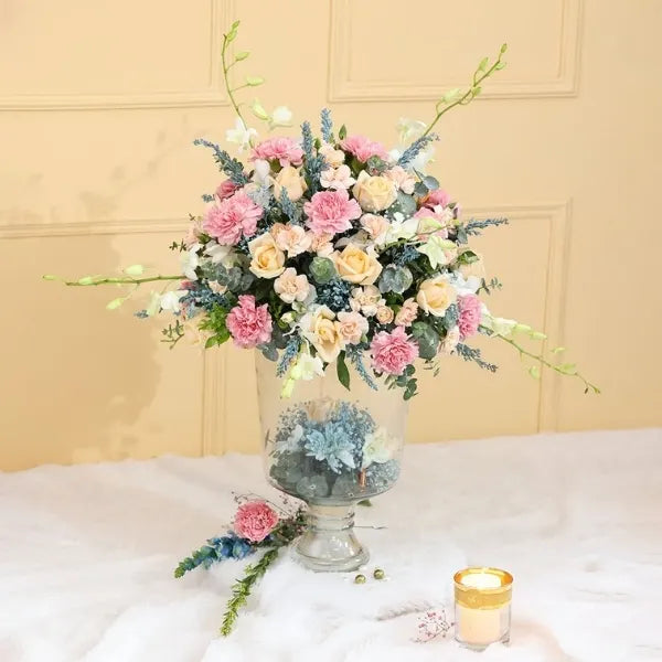 pink carnation and peach rose in glass vase front view