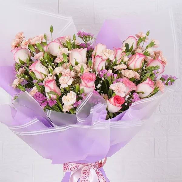 pink roses bouquet with spray carnations closeup view 2