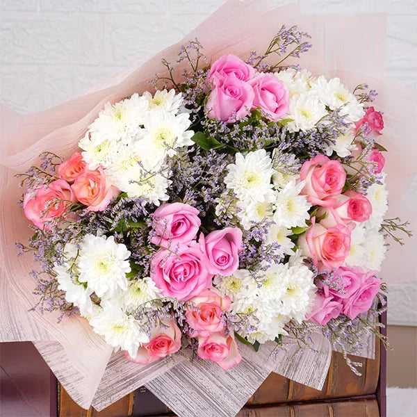 pink roses bouquet with white mums top view