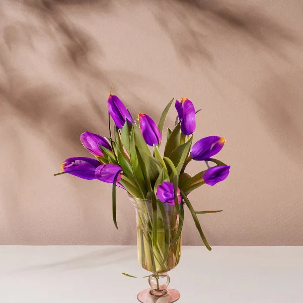 purple 10 tulip flowers with glass vase